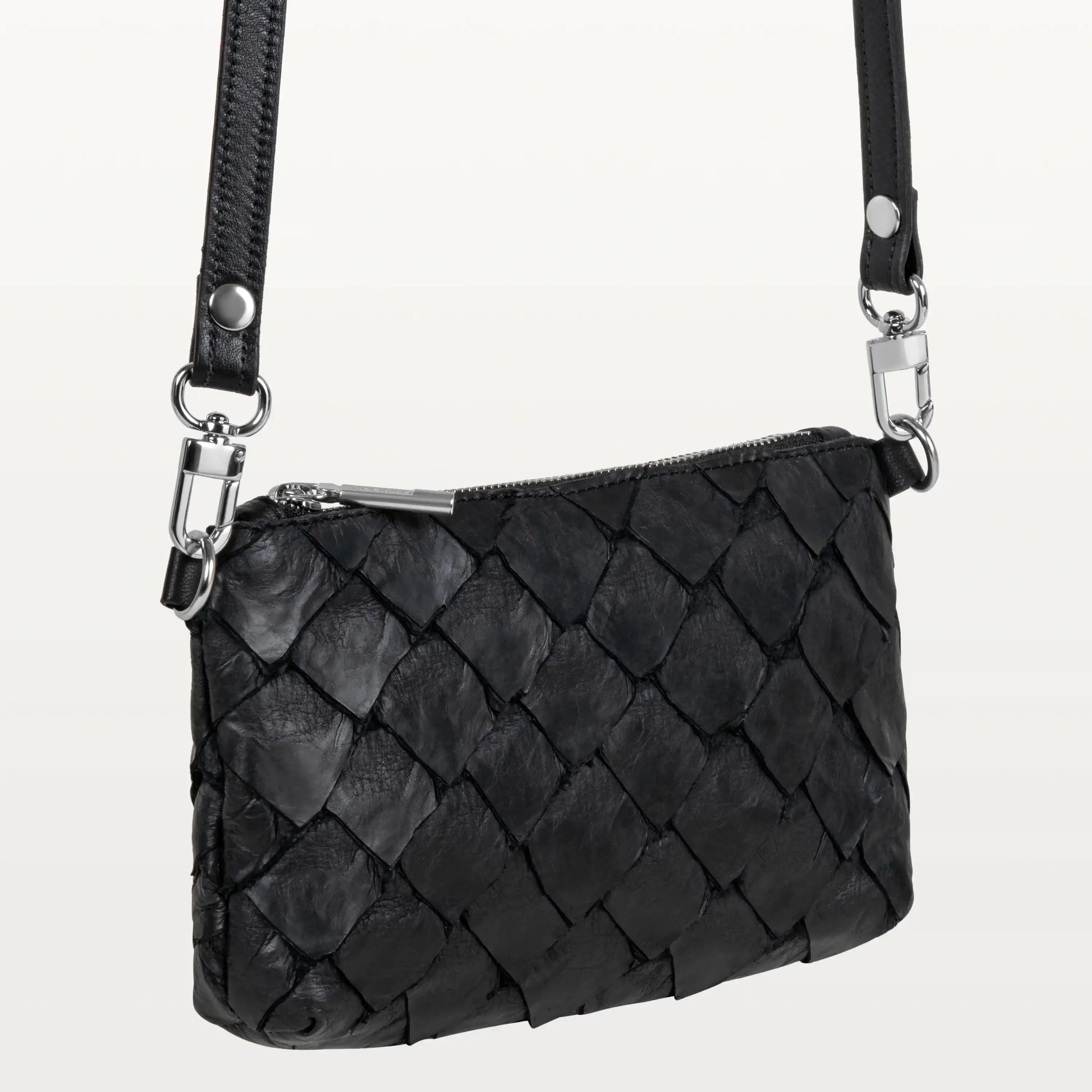 Small rectangular black crossbody bag handcrafted from pirarucu leather with a long crossbody strap and silver hardware.