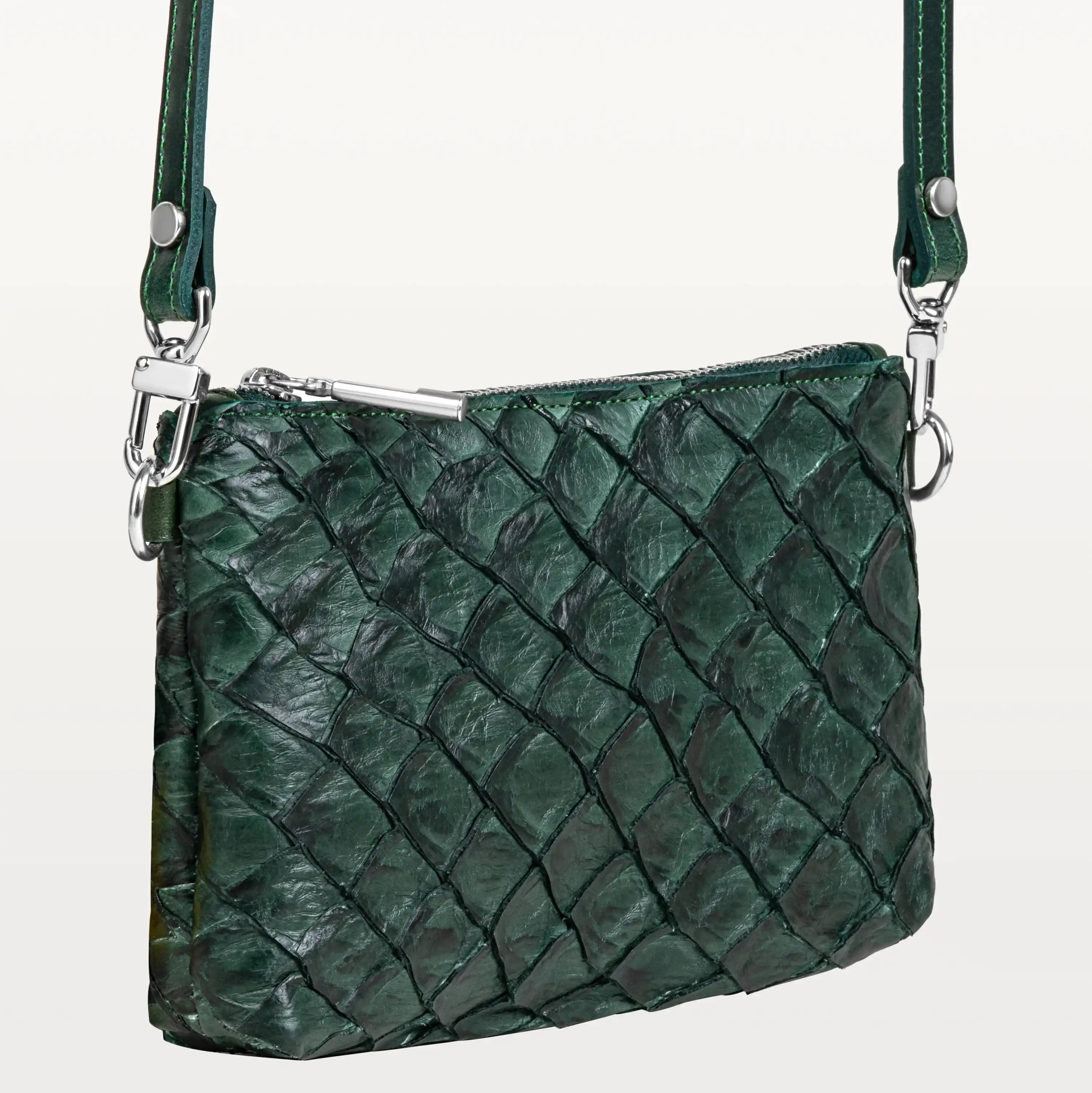 Small rectangular verdant green crossbody bag handcrafted from sustainable pirarucu fish leather with silver hardware.