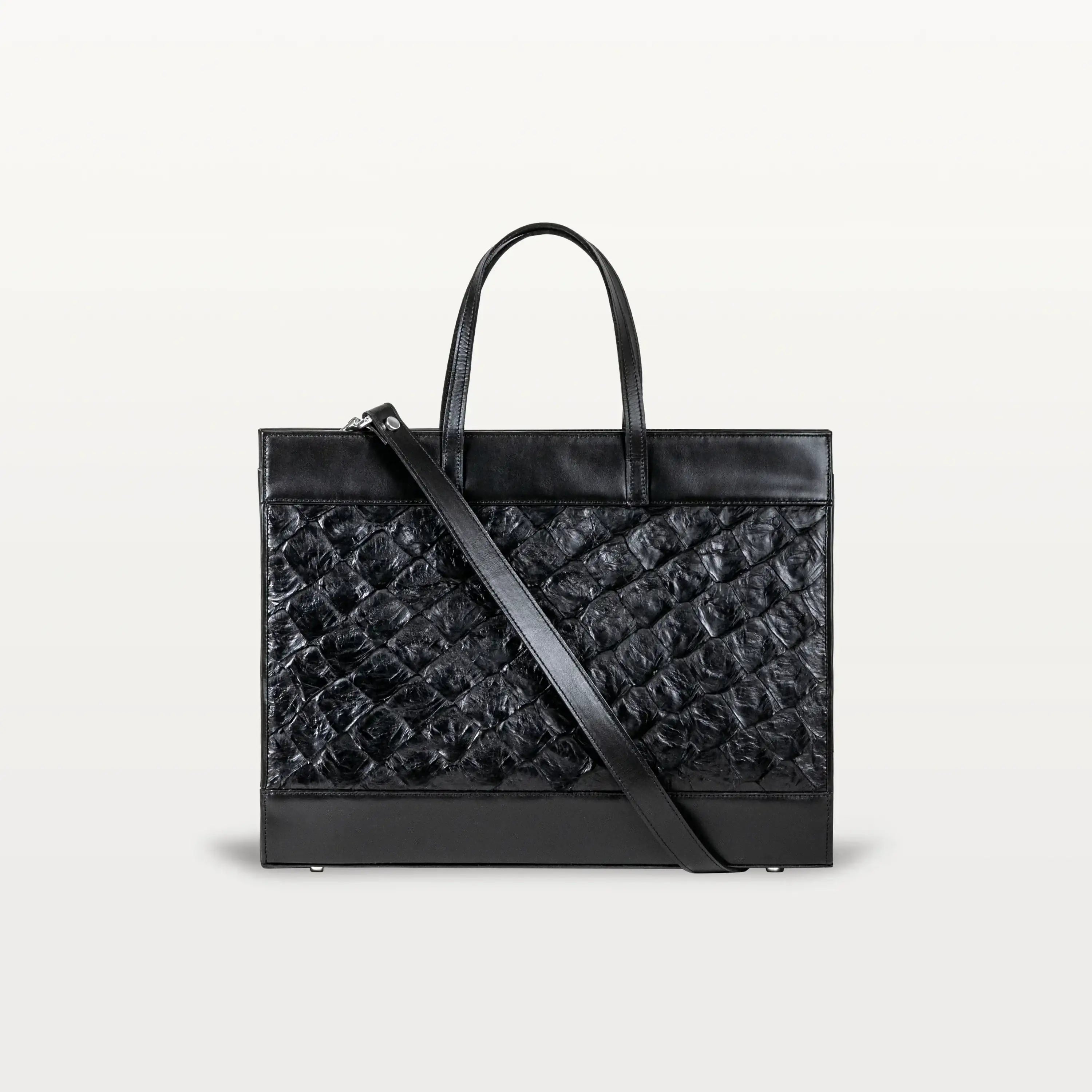 The Braemar tote bag in black pirarucu leather. A large, structured bag with top handles and crossbody strap.