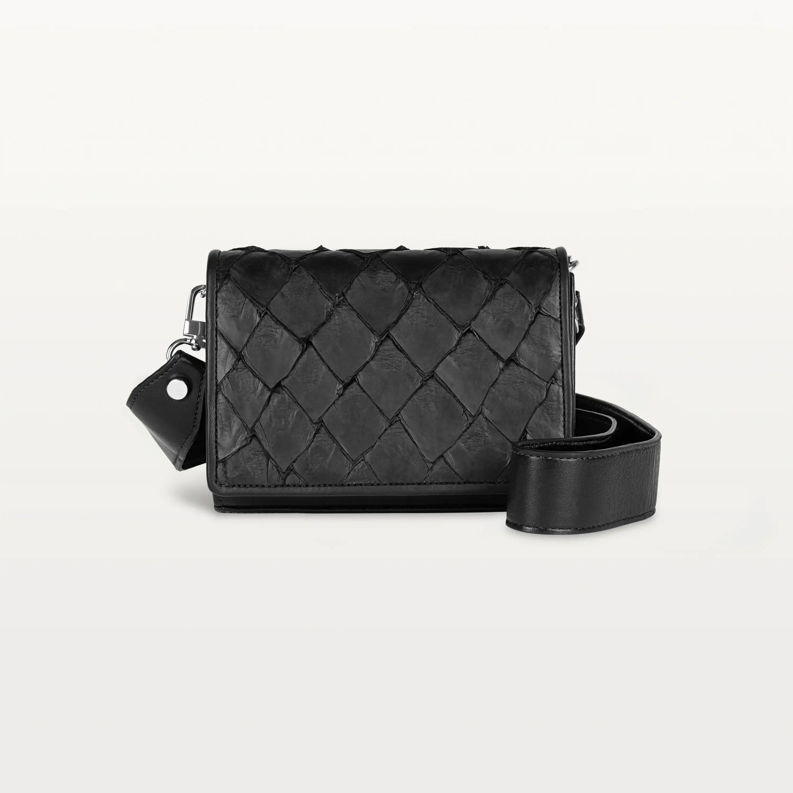 Rectangular black Lola crossbody bag made from pirarucu fish leather with a thick detachable strap and silver hardware.