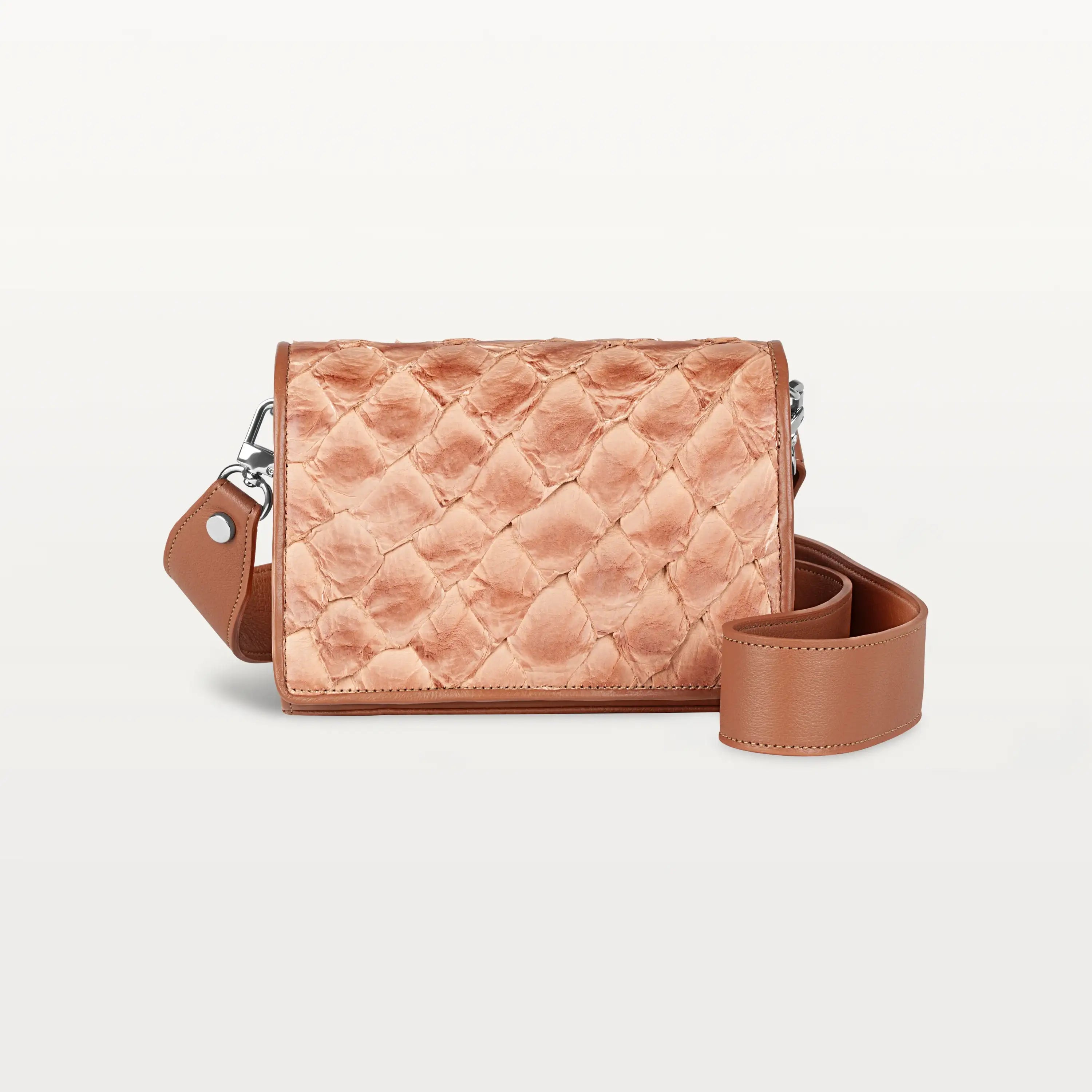 Rectangular cognac Lola crossbody bag made from pirarucu fish leather with a thick detachable strap and silver hardware.
