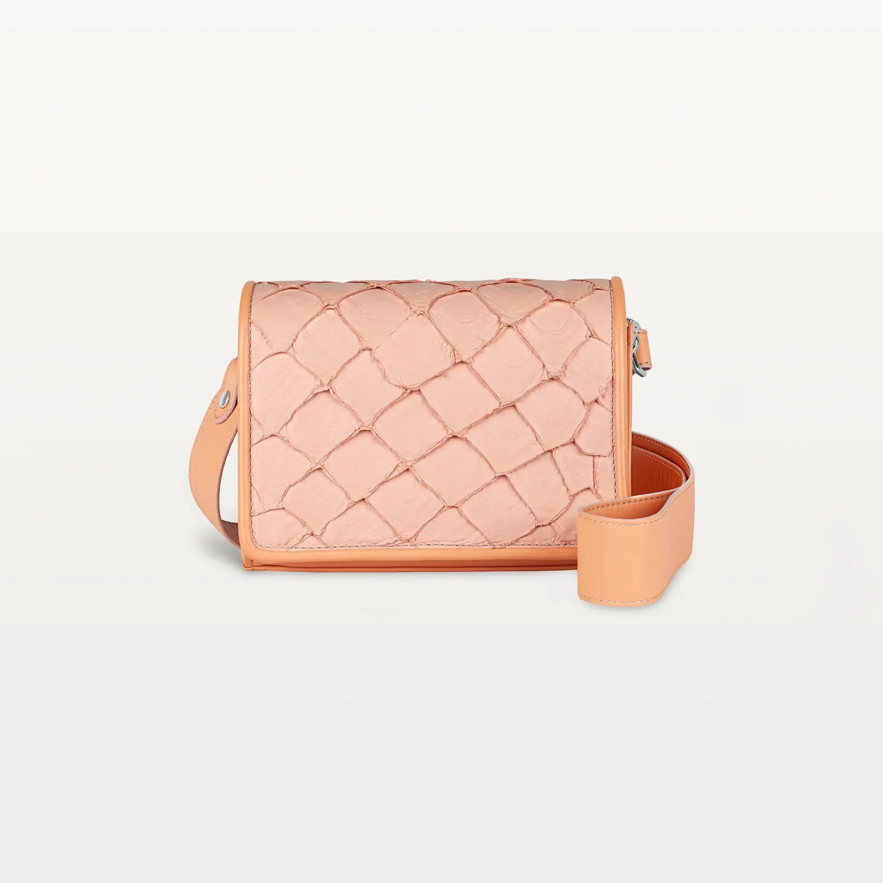 Rectangular pink Lola crossbody bag made from pirarucu fish leather with a thick detachable strap and silver hardware.
