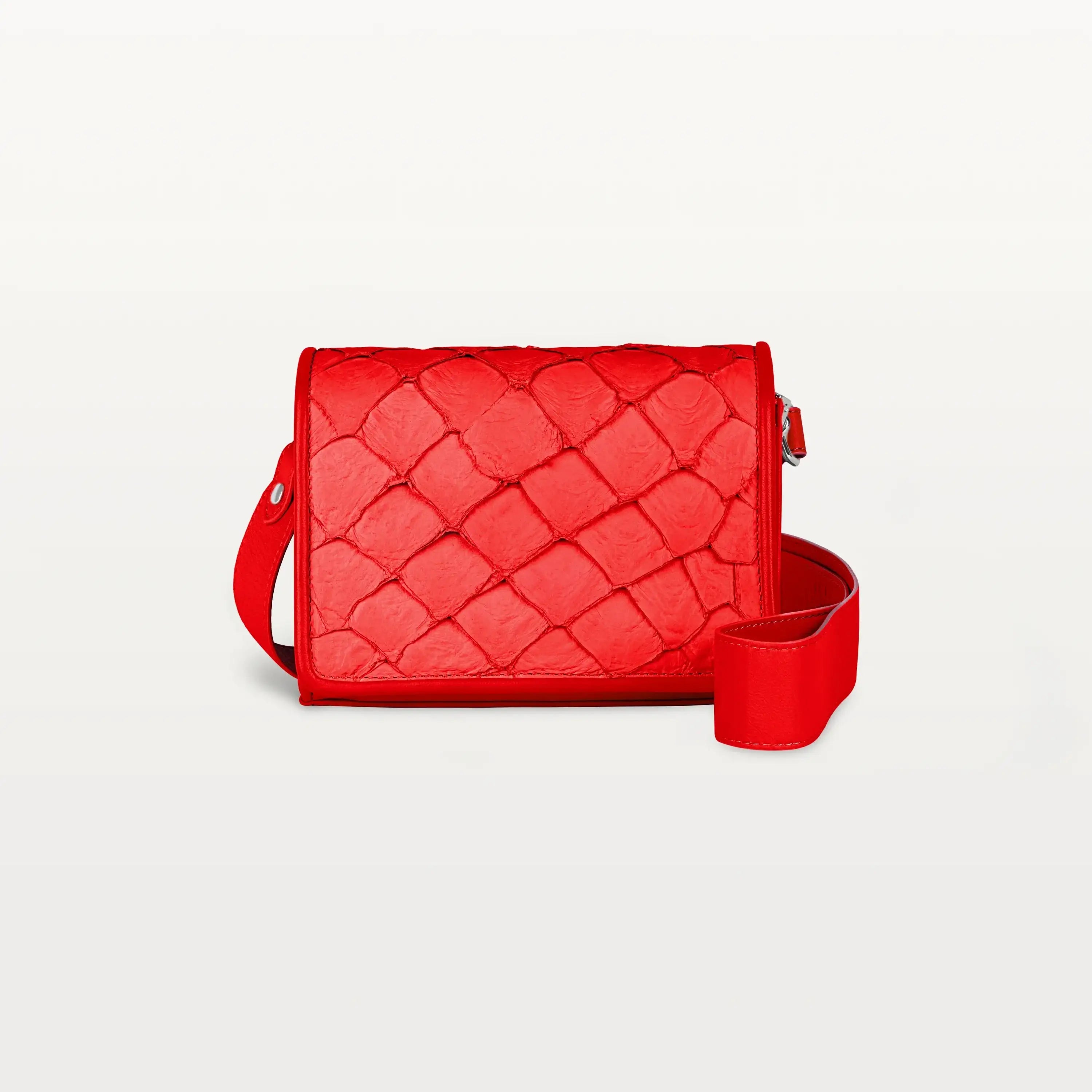Rectangular red Lola crossbody bag made from pirarucu fish leather with a thick detachable strap and silver hardware.