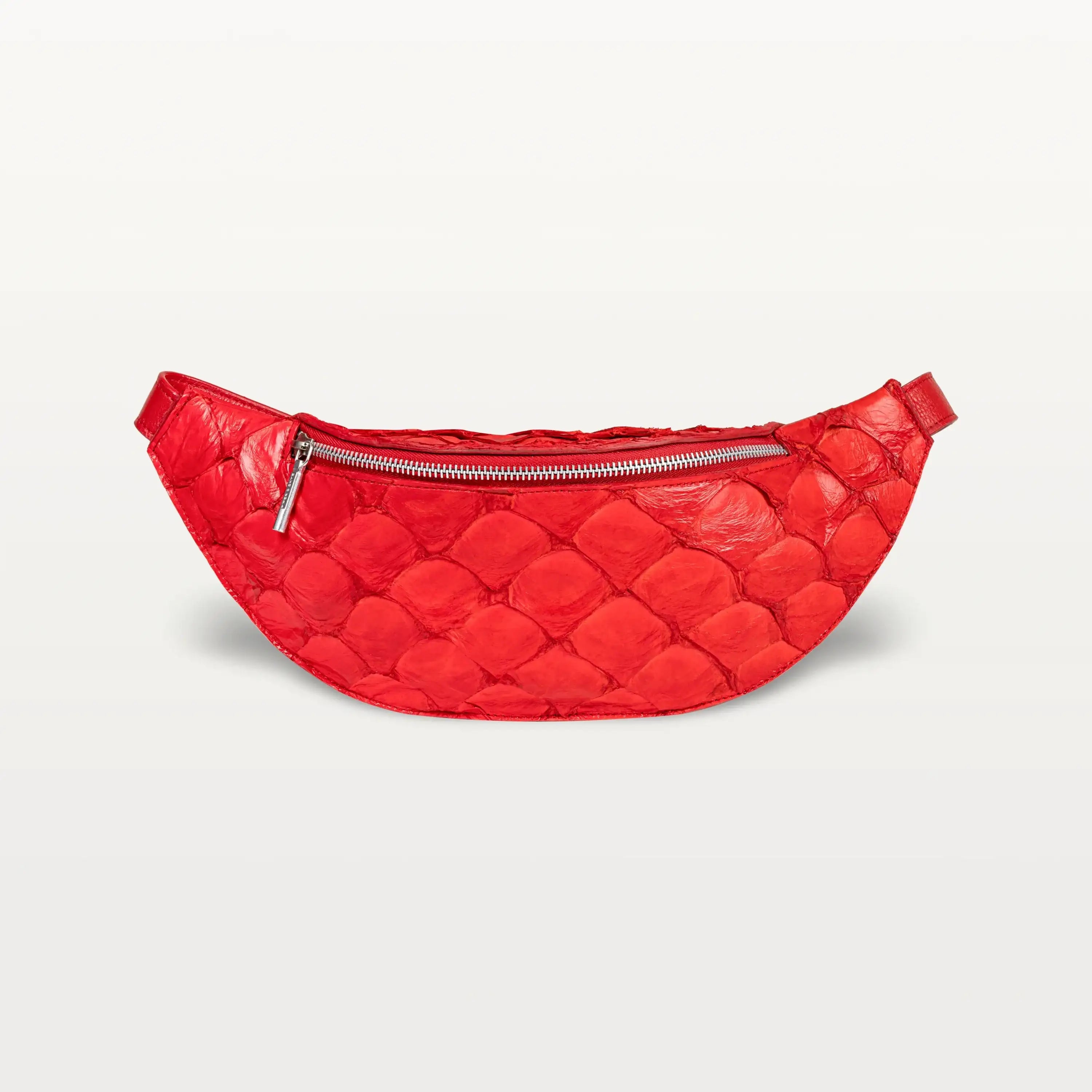 Front view of the Mac Pack belt bag crossbody in red Pirarucu fish leather with a silver zipper and curved body shape.