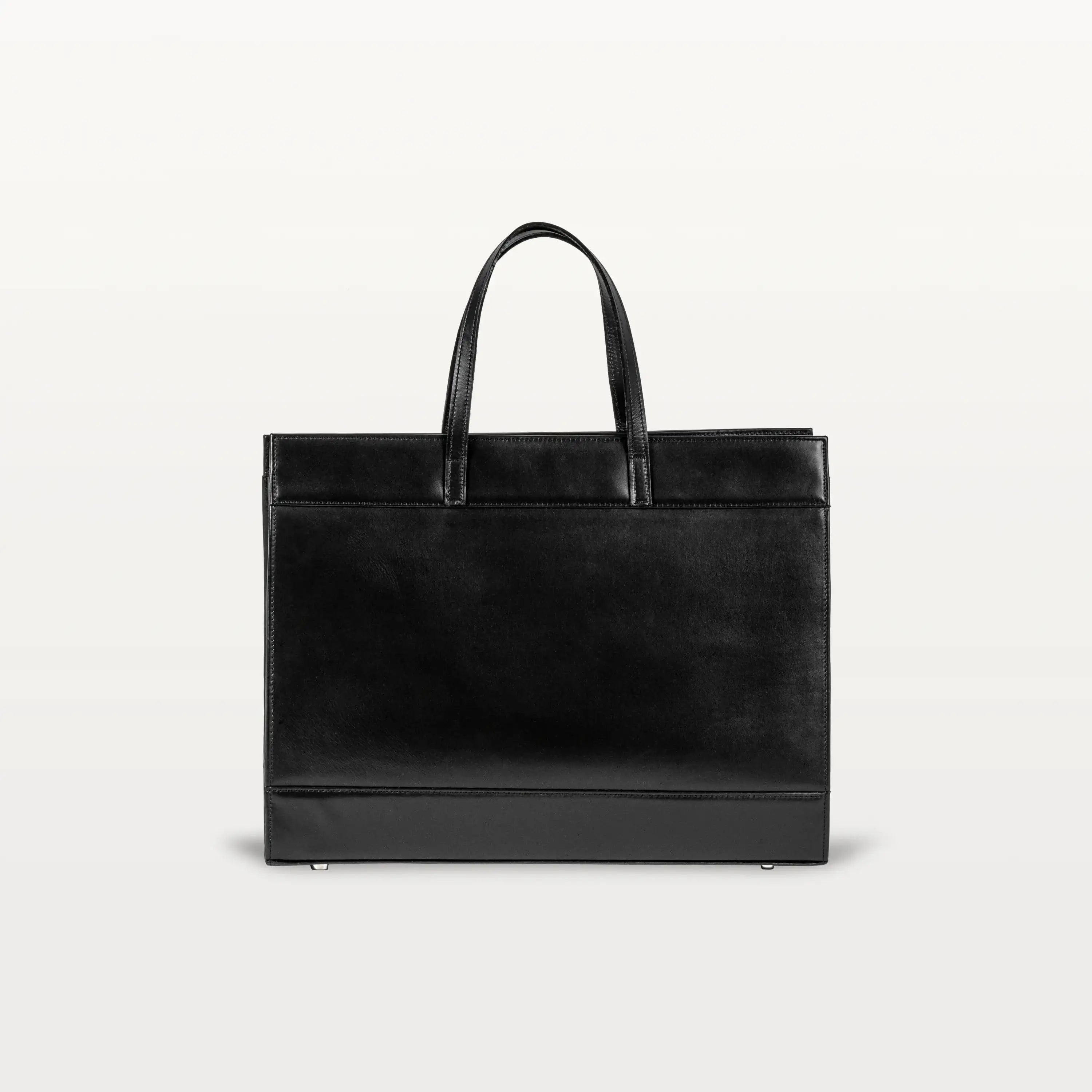 The black bovine leather rear of the Braemar tote bag with the top handles up.