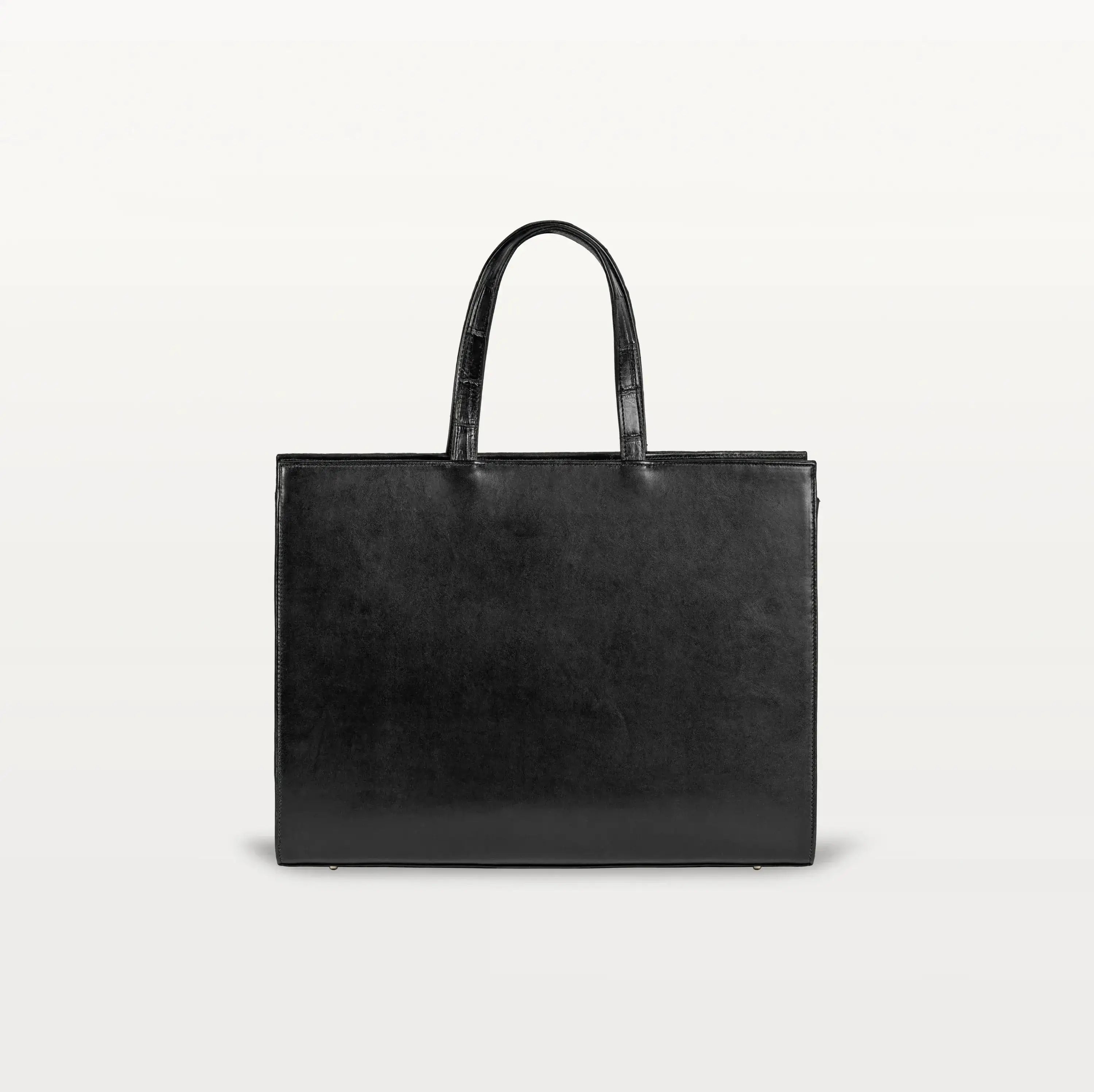 The black bovine leather rear of the Braemar tote bag with the top handles up.