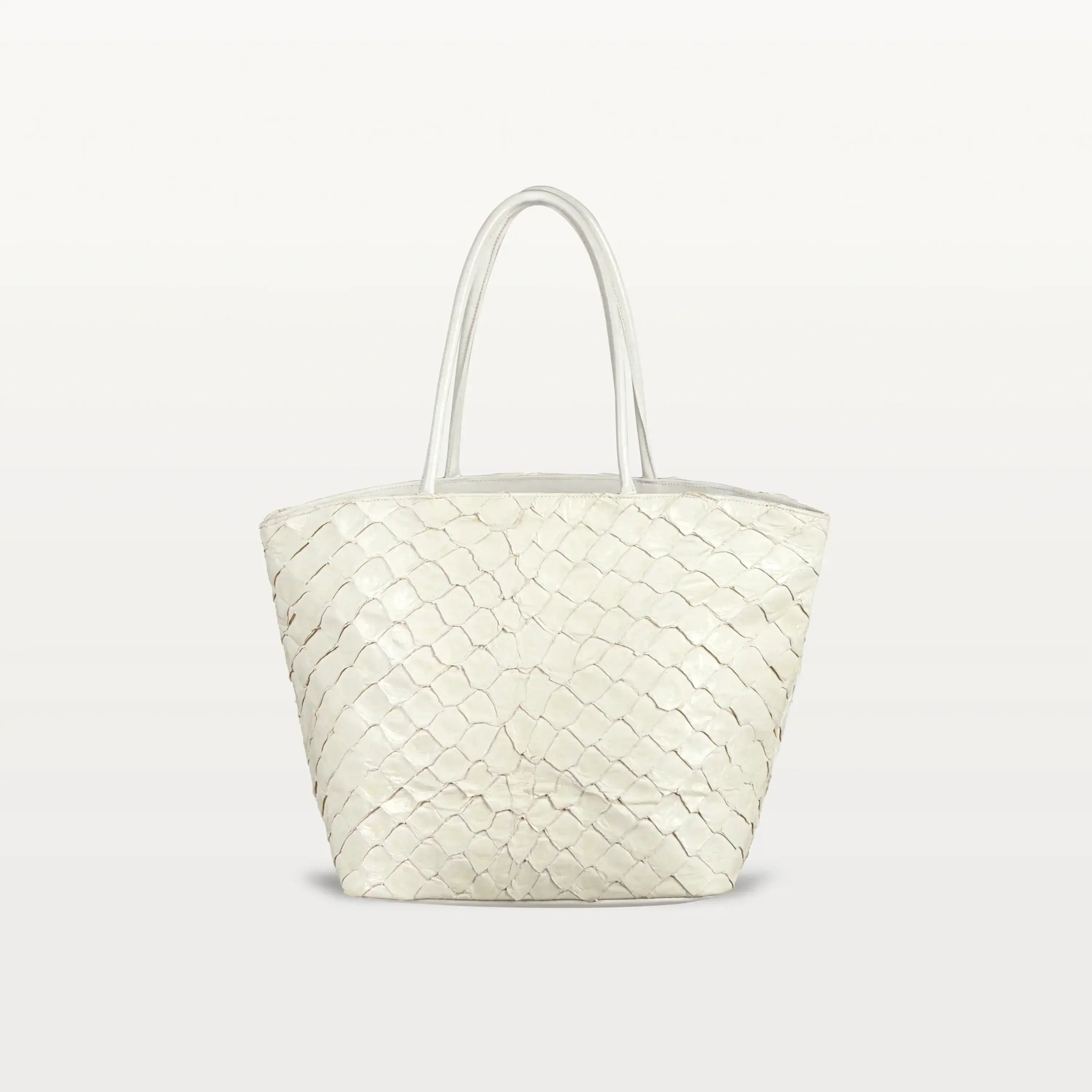 The Delray Shopper in clay white pirarucu leather, a large tote bag with a unique fish scale texture and two top handles. 