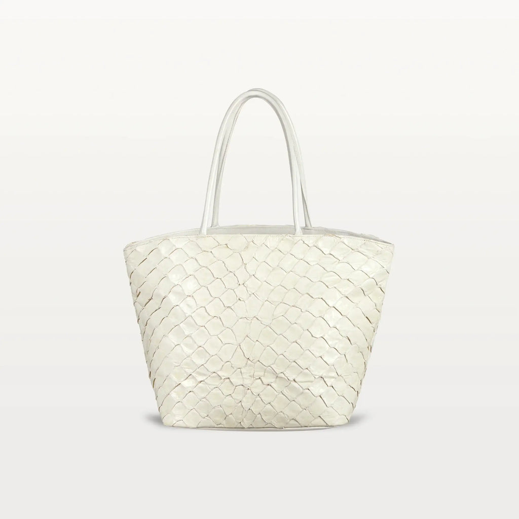 The Delray Shopper in clay white pirarucu leather, a large tote bag with a unique fish scale texture and two top handles. 