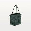 Side view of the spacious Delray Shopper in verdant green pirarucu leather, a large tote bag with a unique fish scale texture and two top handles. 