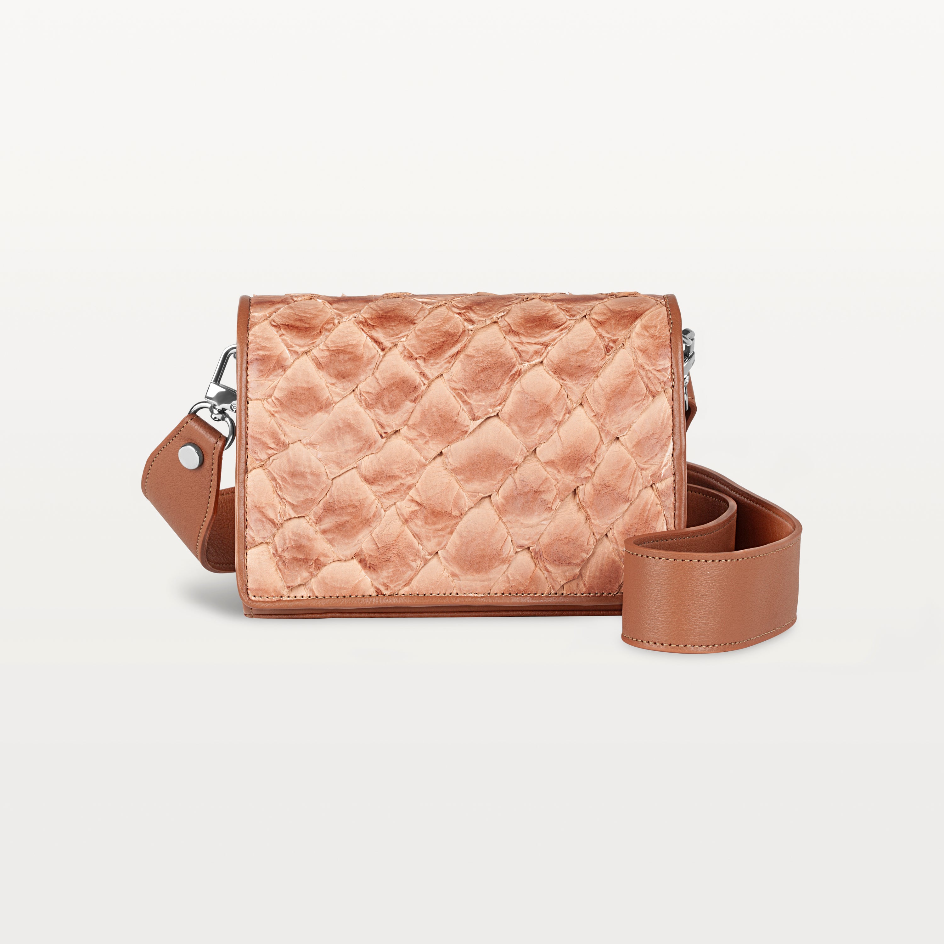 Rectangular cognac Lola crossbody bag made from pirarucu fish leather with a thick detachable strap and silver hardware. 