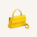 sustainable luxury handbag in canary yellow alligator from piper & skye