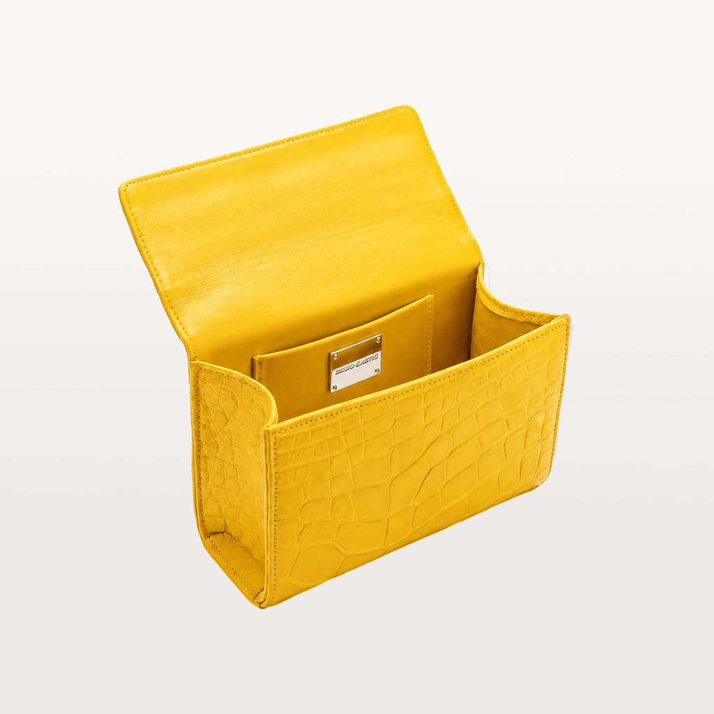 interior view of piper & skye's soho top handle handbag in canary yellow