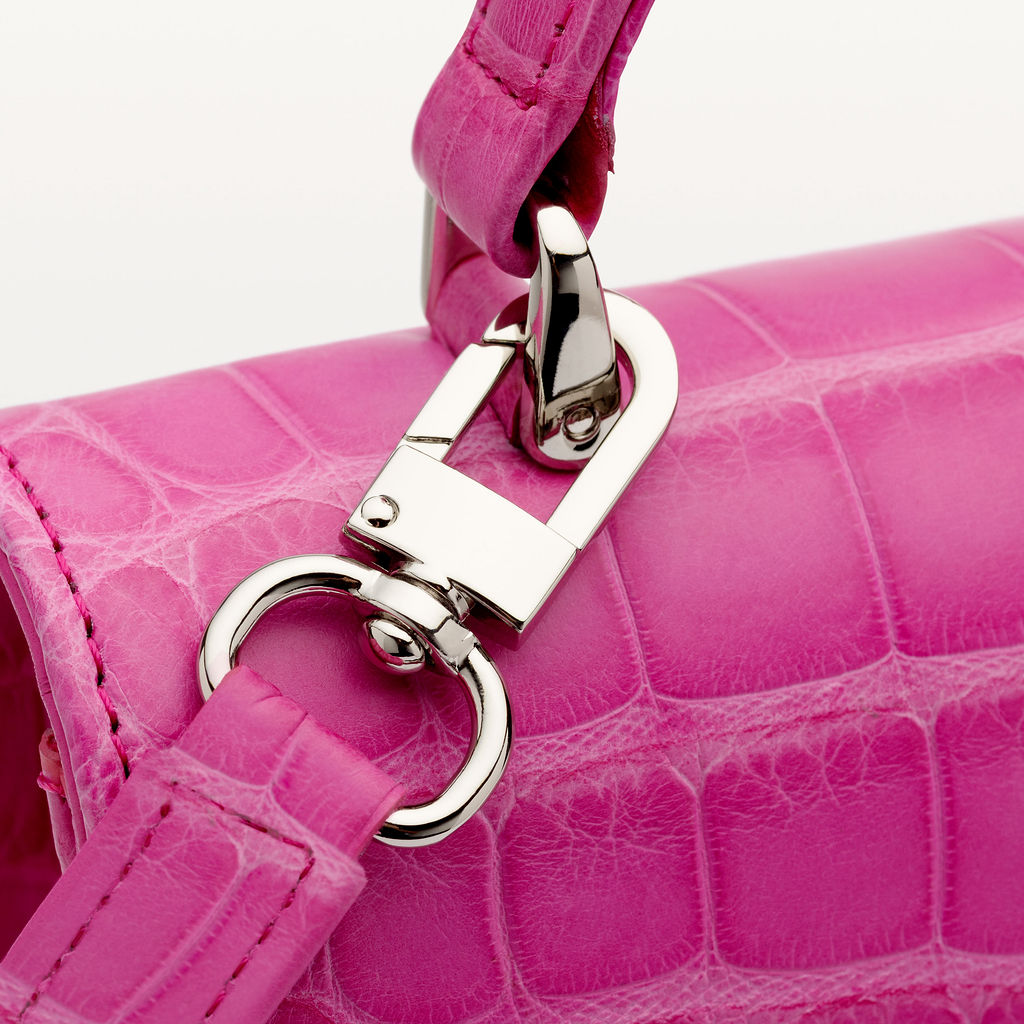 Close up of Piper & Skye's sustainable leather soho top handle handbag with silver hardware