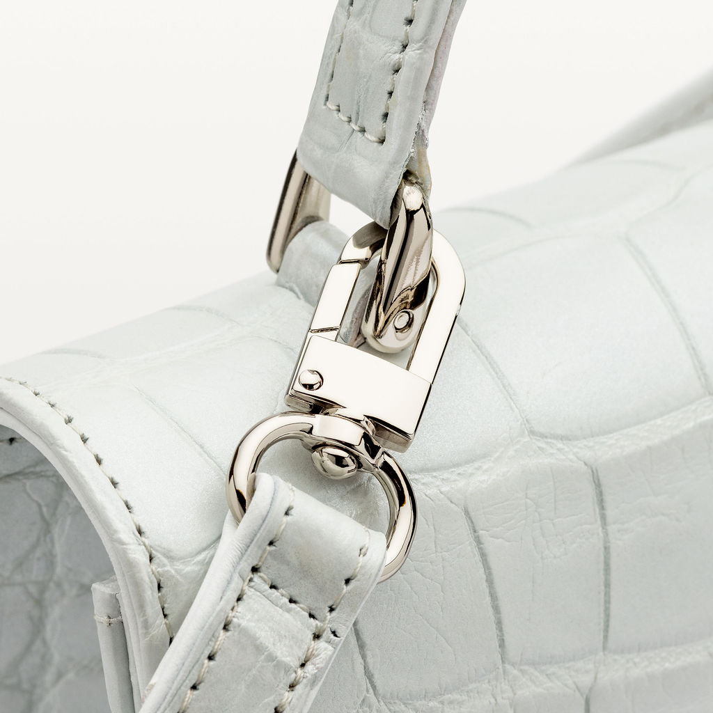 Close up of the silver hardware on the Soho Top Handle crossbody handbag from Piper & Skye
